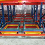 multi-color carts on pushback storage rack